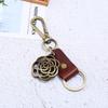 Lote pequeño de regalos creativos hechos a mano llavero redondo de flor de bronce piel de vaca joyería para hombre suministro de fábrica de comercio electrónico transfronterizo