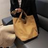 Bolsas Femininas Atacado Outono e Inverno 2025 Bolsa de Ombro Casual de Lona Design Nicho Grande Capacidade Bolsa Tote para Trabalho