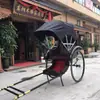 Carruajes de boda de estilo retro vintage para transporte de pasajeros impulsados por humanos para áreas escénicas, similares a los de la República de China, pueden ser tirados por rickshaws