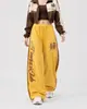 Calça casual listrada com estampa de leopardo estilo de rua americano para homens e mulheres, calça longa solta para dança jazz e esportes, calça de moletom de perna larga para dança