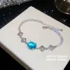 ¡Joyería de cadena colorida! Pulsera ovalada de circonita súper brillante, sensación de lujo ligero y alta gama, joyería versátil y exquisita para mujer al por mayor