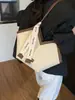 Bolso de hombro tejido con patrón transfronterizo para mujer, nuevo bolso de hombro de diseño de nicho de moda otoño e invierno 2026, bolso de mano popular