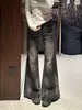 Chao Li tiene en stock jeans de tiro bajo microcampana en negro y gris para mujer, nuevo estilo Otoño 2026, pantalones campana versátiles para estilizar a la chica popular
