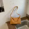 Bolsa feminina de design de nicho estilo francês 2026 novo modelo coreano de alta qualidade bolsa baguette de ombro única bolsa tiracolo