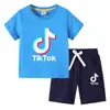 Camiseta infantil 2022 TikTok verano nueva ropa infantil de comercio exterior coreana pantalones cortos de manga corta para niños traje de dos piezas