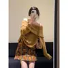 Traje Elegante de Gama Alta para Mujer 2025 Otoño Nuevo Cardigan de Punto Plegado con Solapa Falda Estampada Conjunto de Dos Piezas Moderno