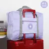 Bolsa de almacenamiento de viaje de gran capacidad aprobada por influencers, portátil y plegable, se puede acoplar al asa de un carrito