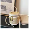 Bolso bandolera de moda estilo coreano 2026 nuevo bolso cubo tejido con estampado de letras de alta gama y bolsa de maquillaje de color contrastante