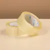 Spot de fábrica gran cantidad de cinta adhesiva selladora de embalaje transparente al por mayor papel de alta adherencia película para embalaje de express