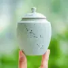 Fabricante: Xingye Yunhe. Bote de té de cerámica, a prueba de humedad y hermético, recipiente de almacenamiento portátil, estéticamente agradable, tamaño pequeño