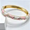 Pulsera triangular de esmalte con forma de diamante en stock transfronteriza con esmalte degradado de color contrastante, directo de fábrica, venta al por mayor de joyería de lujo ligero para comercio exterior