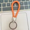 Llavero de cuerda de cuero trenzado simple creativo colgante de muñeca linda accesorios de llave para parejas tendencia regalos pequeños venta al por mayor