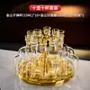Nuevo juego dispensador de copas de licor de vidrio de lujo de alta gama para uso doméstico, copa tipo bala creativa con pan de oro, utensilios de vino de un solo trago
