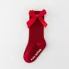Calcetines nuevos para niños y niñas de color sólido a rayas de algodón antideslizantes con boca de burbuja y lazo para bebé al por mayor
