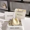 Moda nicho dropshipping bolso cubo repujado 2026 primavera nuevo bolso bandolera de alta gama al por mayor