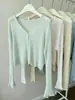 Nudo de bambú gancho de cáñamo flor hueca borde de oreja de madera cardigan de punto con cuello en V para mujer verano delgado protección solar cardigan capa exterior cover-up para mujer