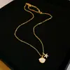Collar con colgante de calabaza con incrustaciones de circonita y técnica de goteo de aceite para otoño e invierno, sensación de lujo ligero y alta gama, cadena para la clavícula, joyería versátil de nicho para el día a día de las mujeres