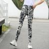 Calças xadrez clássicas Joker pretas e brancas, leggings estampadas, uso externo, calças grandes elásticas, primavera e outono, finas, atacado de fábrica