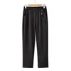 Nueva colección de otoño de pantalones gruesos para mujeres de mediana edad y mayores, color liso, cintura elástica, que ocultan el abdomen, talla grande, pantalones de pierna recta para madres
