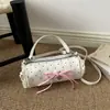 Bolsa de mão fashion e doce estilo coreano com laço e poá, compacta e estilosa, elegante bolsa transversal cilíndrica