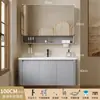 Tocador de baño engrosado y ahorrador de espacio con diseño en color crema, que cuenta con un lavabo redondeado, lavabo cerámico integrado y un lavabo de una sola pieza.
