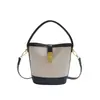 Bolso moderno de bloques de color para mujer, nueva colección otoño 2026, elegante y versátil para el trabajo, bolso de hombro, bolso cruzado, bolso tipo cubo casual