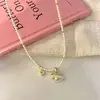 Colar de Pérolas Pônei Dourado para Mulheres, Acessório de Pescoço de Luxo de Nicho para Primavera e Verão, Nova Corrente de Suéter 2026