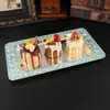Bandeja metálica ovalada de estilo europeo con motivos florales de colores esmaltados, adecuada para servir fruta, como bandeja de té en hoteles, o para guardar frutos secos.; una pieza decorativa para la decoración del hogar