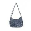 Bolso nuevo de mezclilla 2026 para mujer, con múltiples bolsillos, una correa para el hombro y un diseño cruzado.. Este pequeño bolso de estilo retro es versátil, tiene un aspecto vintage y es una opción de moda para mujeres.