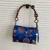 Bolso casual versátil de estilo nacional chino nuevo transfronterizo, bolso de mano retro estilo vacacional de bambú, bolso de hombro y axila para mujer