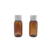 Frasco de amostra translúcido marrom de 50ml com tampa flip-top, ombro arredondado e fundo arredondado, para shampoo, condicionador, loção, tamanho de teste, frasco reutilizável