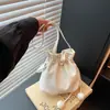 Bolso de cubo con cordón de moda transfronterizo, elegante, casual, lindo minibolso cruzado, bolso de hombro de color liso para el trabajo y los desplazamientos