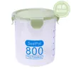 Tarro sellado de plástico transparente de grado alimenticio para almacenamiento de granos de cocina, aperitivos y té seco.