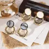 Pendientes Geométricos Huecos de Piedra Ojo de Gato Círculo Aguja de Plata Moda Versátiles de Nicho Pendientes Elegantes Pendientes con Sentido de Diseño de Personalidad