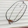 Pendente Minimalista Coração em Aço Titânio com Corda Trançada, Inspirado em Design Levemente Luxuoso, Colar Versátil Casual Ins Nicho High-End Coração de Pêssego