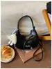Bolso de Asa de Luna de Lujo Ligero de Nicho Súper Popular 2026 Nuevo Otoño/Invierno Versátil de Lujo Ligero de Nicho para el Trabajo