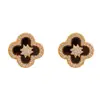 Pendientes de botón de flor de cuatro hojas de circonio de moda versátiles estilo francés, exquisitos, sencillos, dulces, compactos y adecuados para ir al trabajo, con sentido del diseño