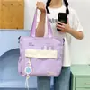 Bolsa para estudiantes mujeres que toman clases de tutoría, bolso de hombro conveniente, nuevo bolso de lona de verano 2026, bolso cruzado de diseño nicho