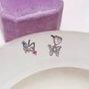 Aretes pequeños de mariposa con bloques de color, calados, diseño de nicho dulce y cool, para el cuidado de las orejas
