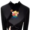 Ropa interior térmica para niñas Otoño/Invierno 2026 Nuevo estilo Terciopelo alemán Top de manga larga con volantes y cuello alto para niños de mediana y mayor edad