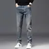 Jeans de alta gama para hombre de Hong Kong, corte recto ajustado de 9 puntos, nuevos pantalones casuales elásticos versátiles 2026
