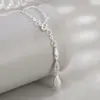 Nuevo Collar de Cadena para Clavícula con Borla de Gota de Agua Cepillada y Circonita Micro-Pavimentada para Mujer, Lujo Ligero, Temperamento de Gama Alta, Diseño de Nicho
