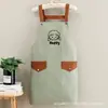 Delantal de lona moderno con logo estampado, nuevo diseño simple, anti-manchas y resistente al desgaste, especializado para servicio de comedor, ropa de trabajo para mujer