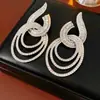 Aretes Geométricos de Círculo Hueco con Incrustaciones de Diamantes en Aguja Plateada, Aretes Versátiles de Moda Retro, Aretes Exagerados de Lujo Ligero para Mujer