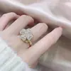 Amazon Venta Caliente Transfronteriza Collar Anillo Giratorio Incrustado de Diamantes Trébol de Cuatro Hojas Anillo Abierto Ajustable Venta al por Mayor desde el Fabricante