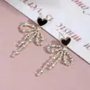 Aretes Clásicos de Corazón con Lazo, Lujo Accesible, Modernos, de Gama Alta, Aretes Elegantes y Sofisticados para Mujer, Llenos de Diamantes, Aretes de Estilo Dulce y Fresco