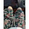 Diseño de nicho sentido pantalones cortos instantáneos para hombre verano estampado completo jacquard peso pesado pantalones de cinco puntos ropa exterior de alta calle americana pantalones de longitud media