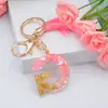 Nuevo llavero de borla rosa 26 letras de cristal inglés gota pegamento colgante borla de moda europea y americana bolsa regalo