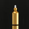 Botella de aceite esencial con galvanoplastia de oro, subbotella cosmética, botella de spray, botella de vidrio prensado, botella de loción crema a prueba de luz