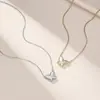 Collar de plata de ley S925 estilo ins europeo y americano con diseño de molino de viento y mariposa, mariposa texturizada, moderno y versátil, colgante de lujo ligero para niñas